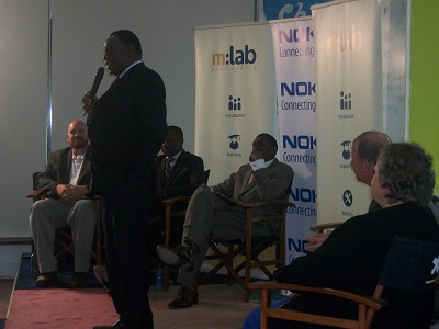 P.S Ministry of Information and Communication Technology Dr.Bitange Ndemo giving a talk during the launch m:lab East Africa where eMobilis is part of the consortium.